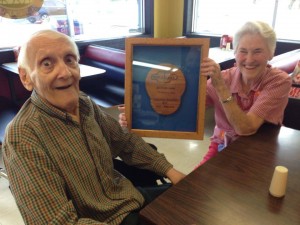 My parents with a plaque made for my dad by one of his Triple T employees.